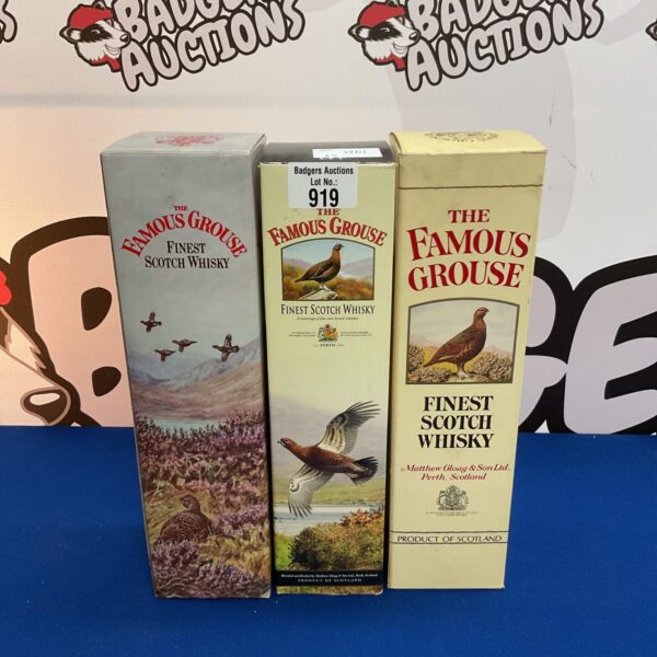 Three sealed bottles of Famous Grouse Scotch whisky in original packaging.