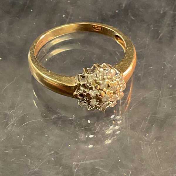 Hallmarked 9 ct gold diamond cluster ring 2.34g gross size l missing two stones
