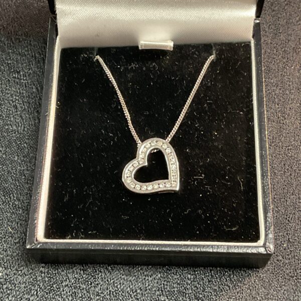 Sparkling diamond heart pendant in 9ct white gold on a chain.