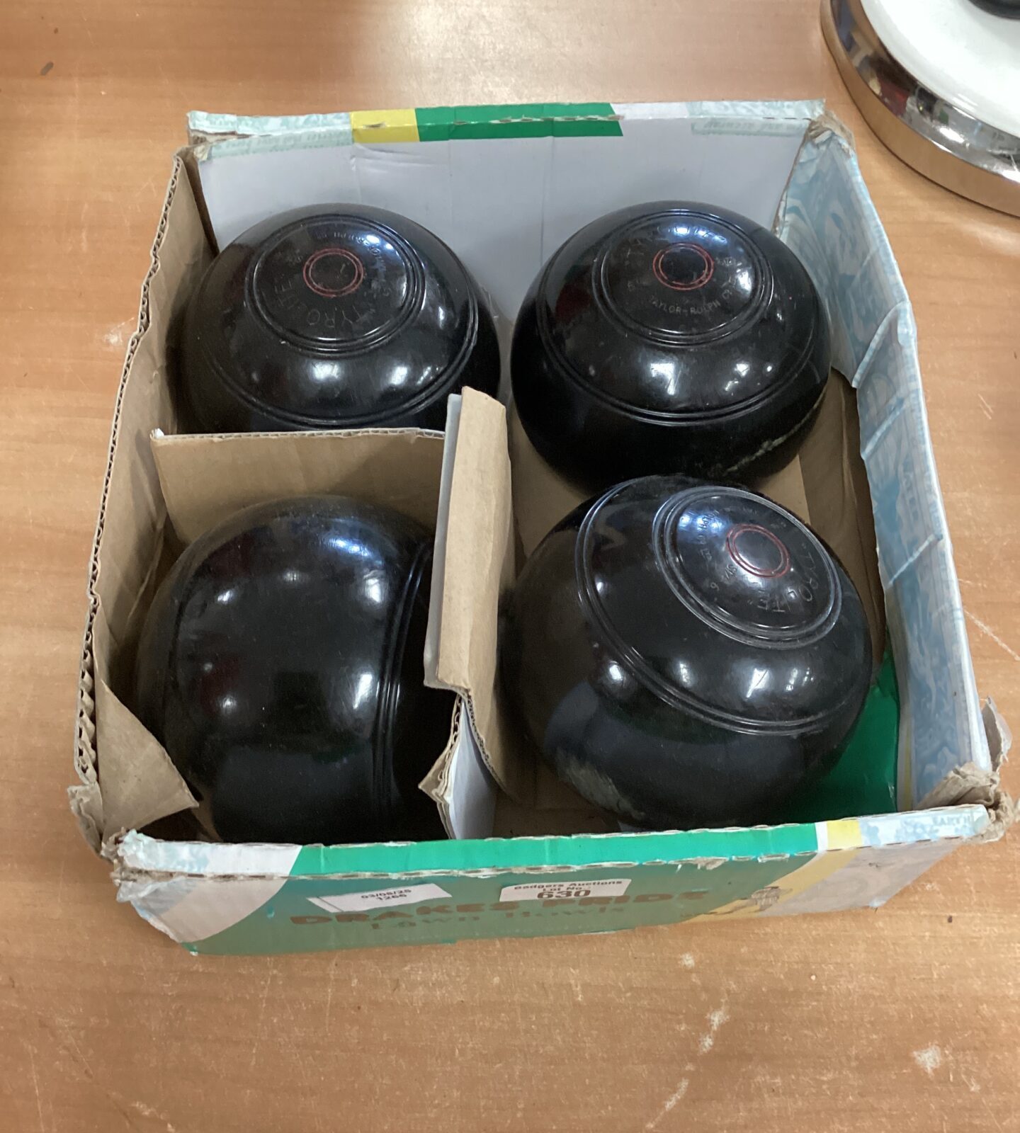 Set of four tyrolite lawn bowls