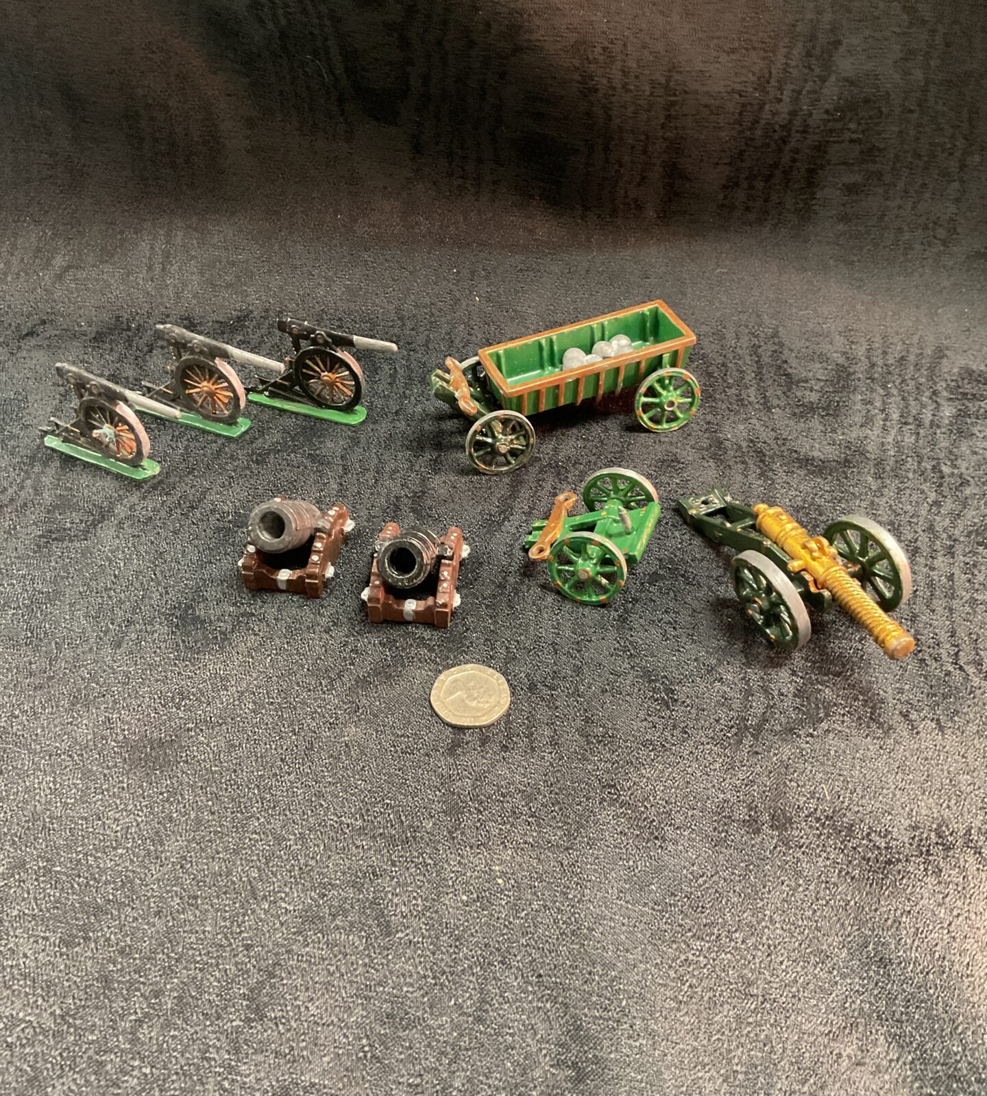 Collection of vintage lead gun carriages and cannons