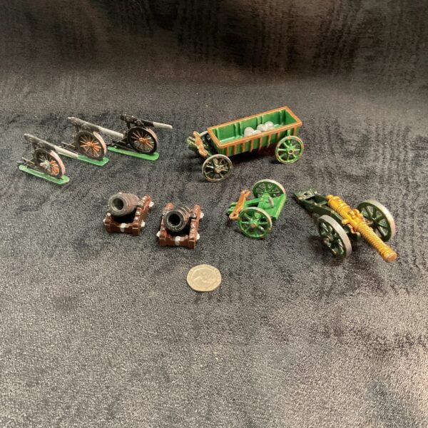Collection of vintage lead gun carriages and cannons