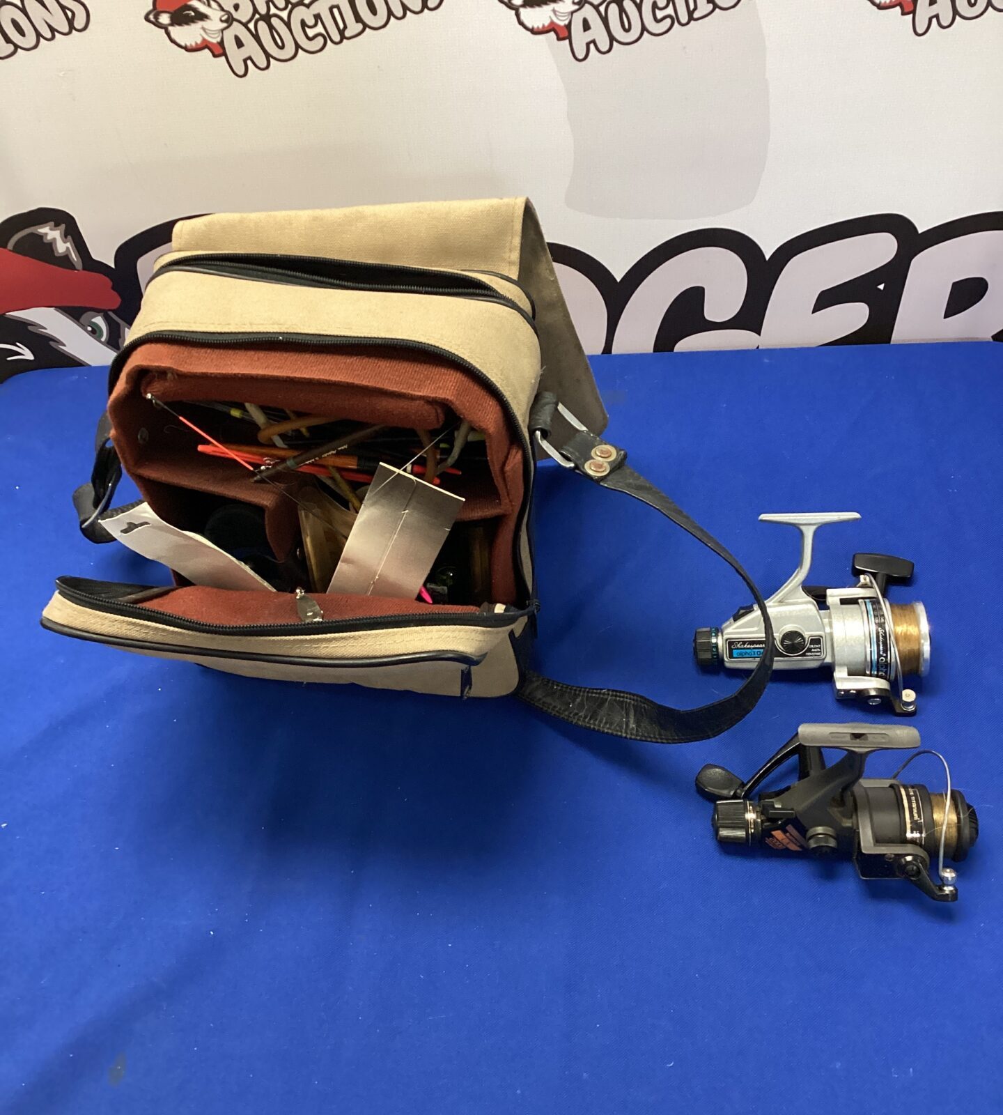 Beige fishing bag with floats & two reels inc shimano LX2000 reel