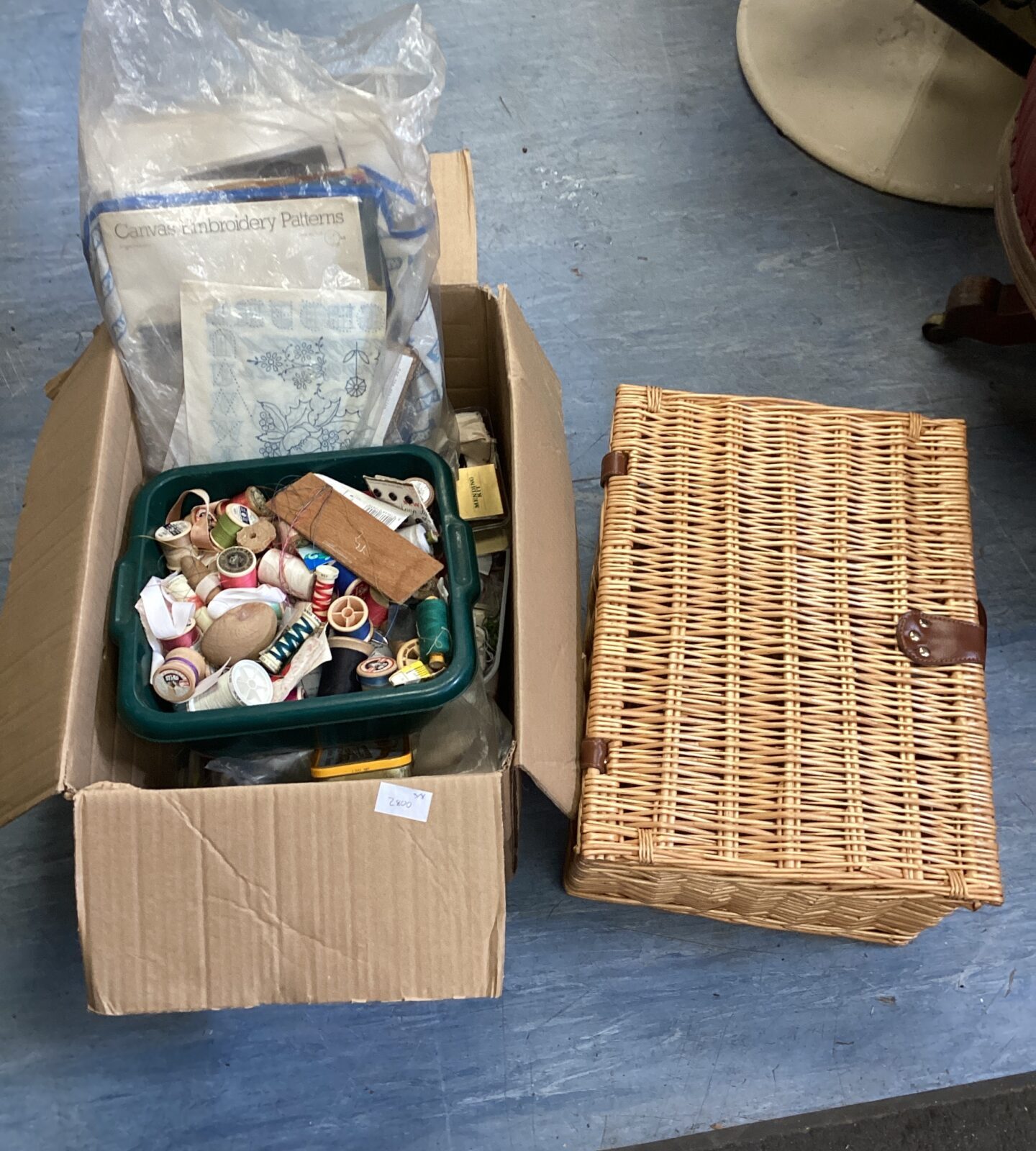 Wicker basket with box of mixed sewing items & patterns