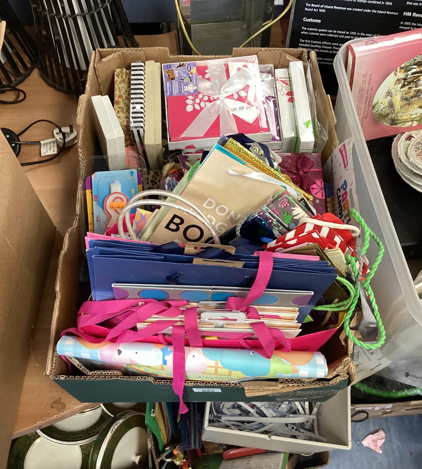 Box of mixed party supplies inc gift bags, candles & balloons