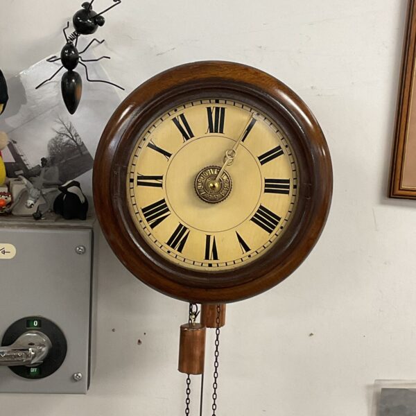Antique German postman alarm clock circa 1880 with weights and pendulum.
