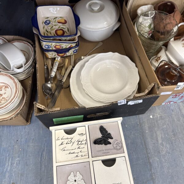 Mixed crockery lot with casserole dish and plates.