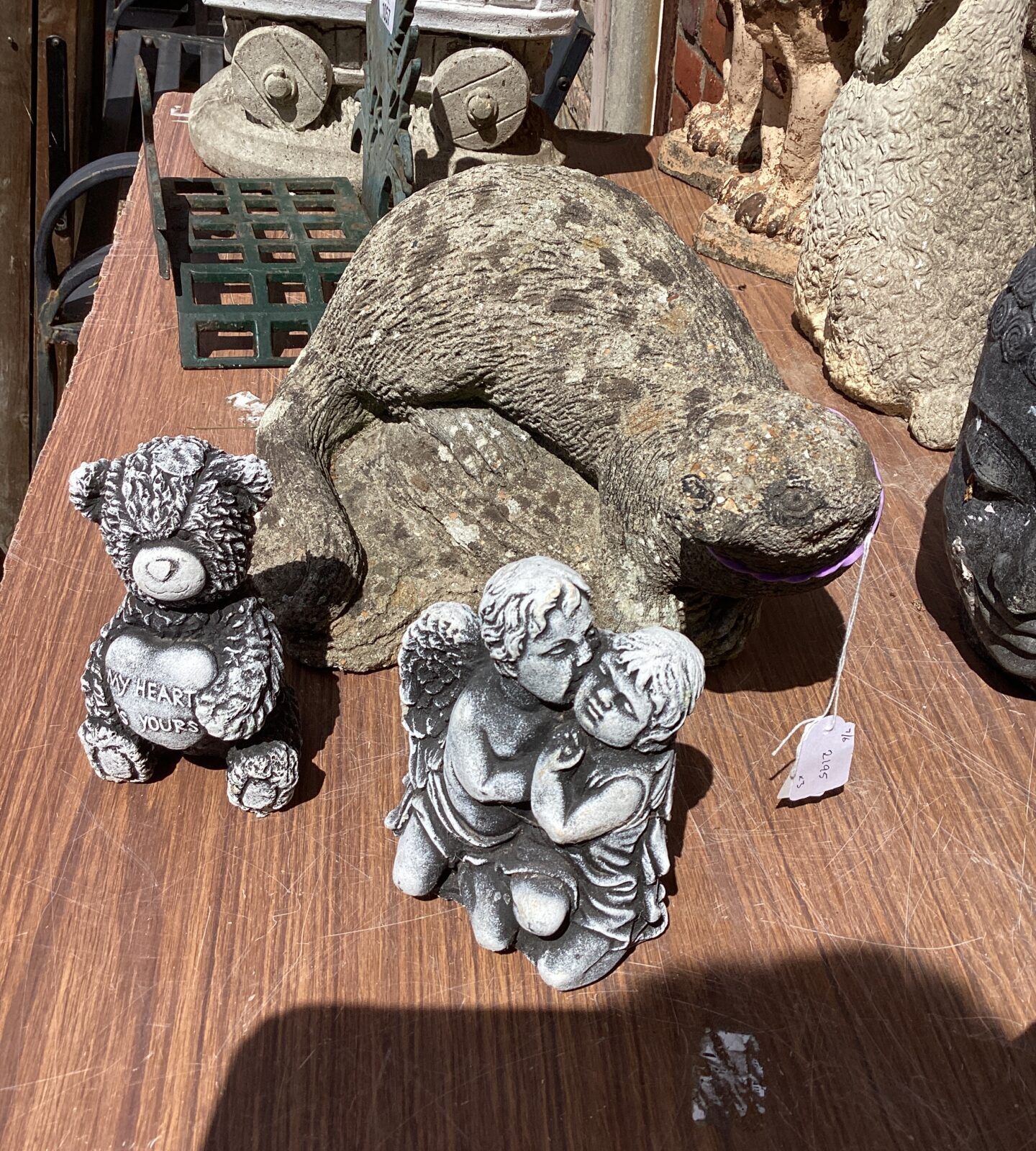 Three garden ornaments inc Otter