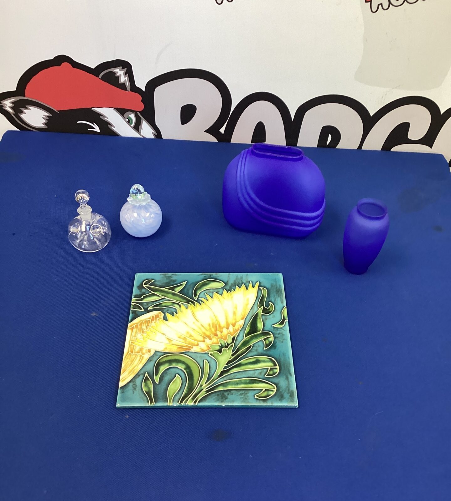Handpainted Flower Pot Stand with perfume bottles and blue glass vases