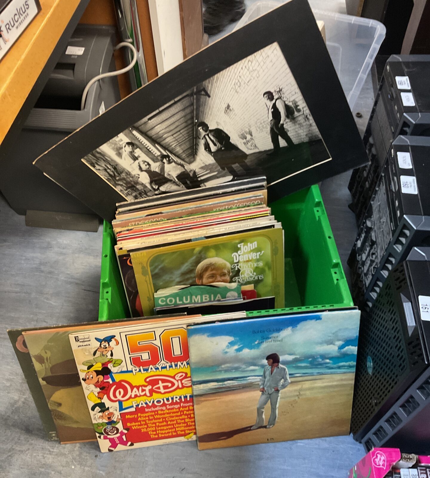 Box of 12” vinyl records including photograph prints of classic bands