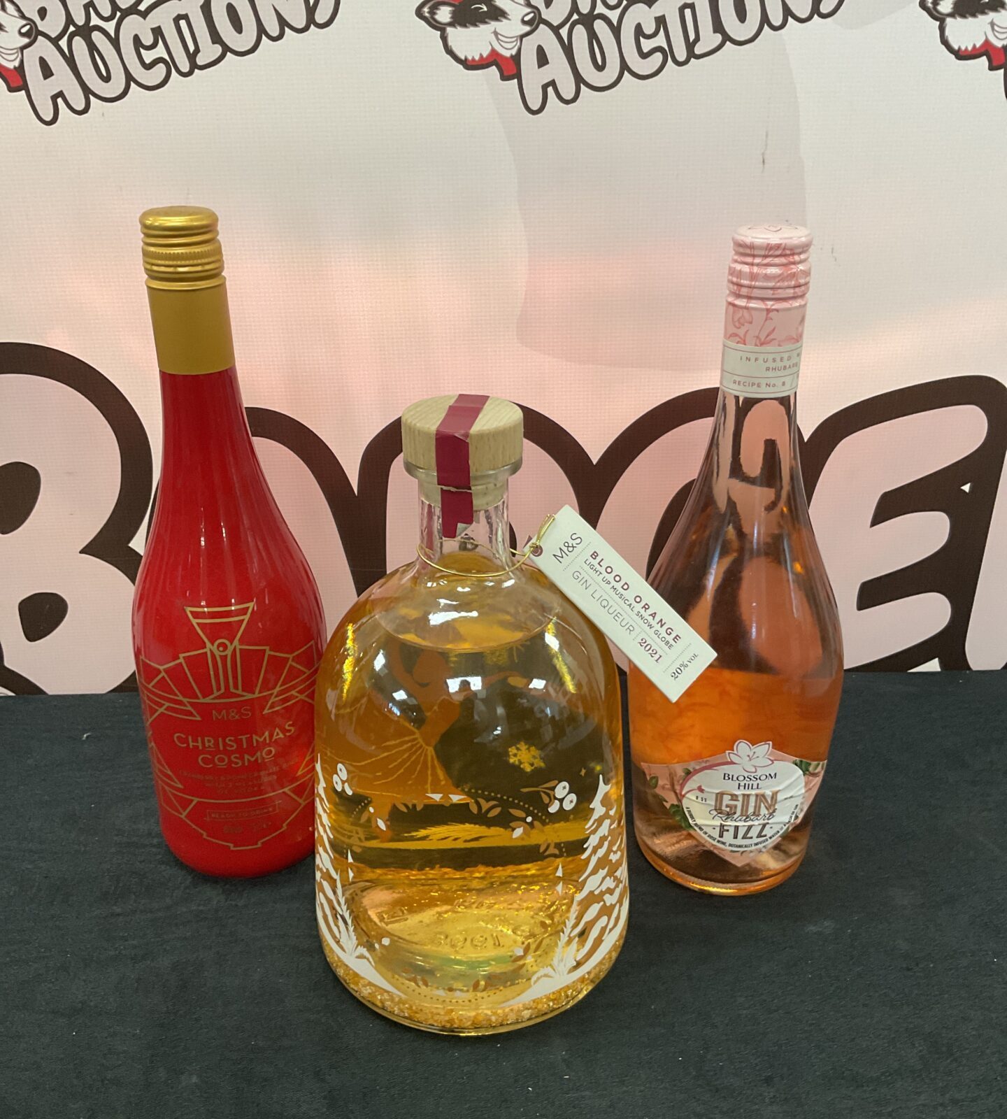 Three sealed bottles of alcohol including m&s blood orange gin liquer