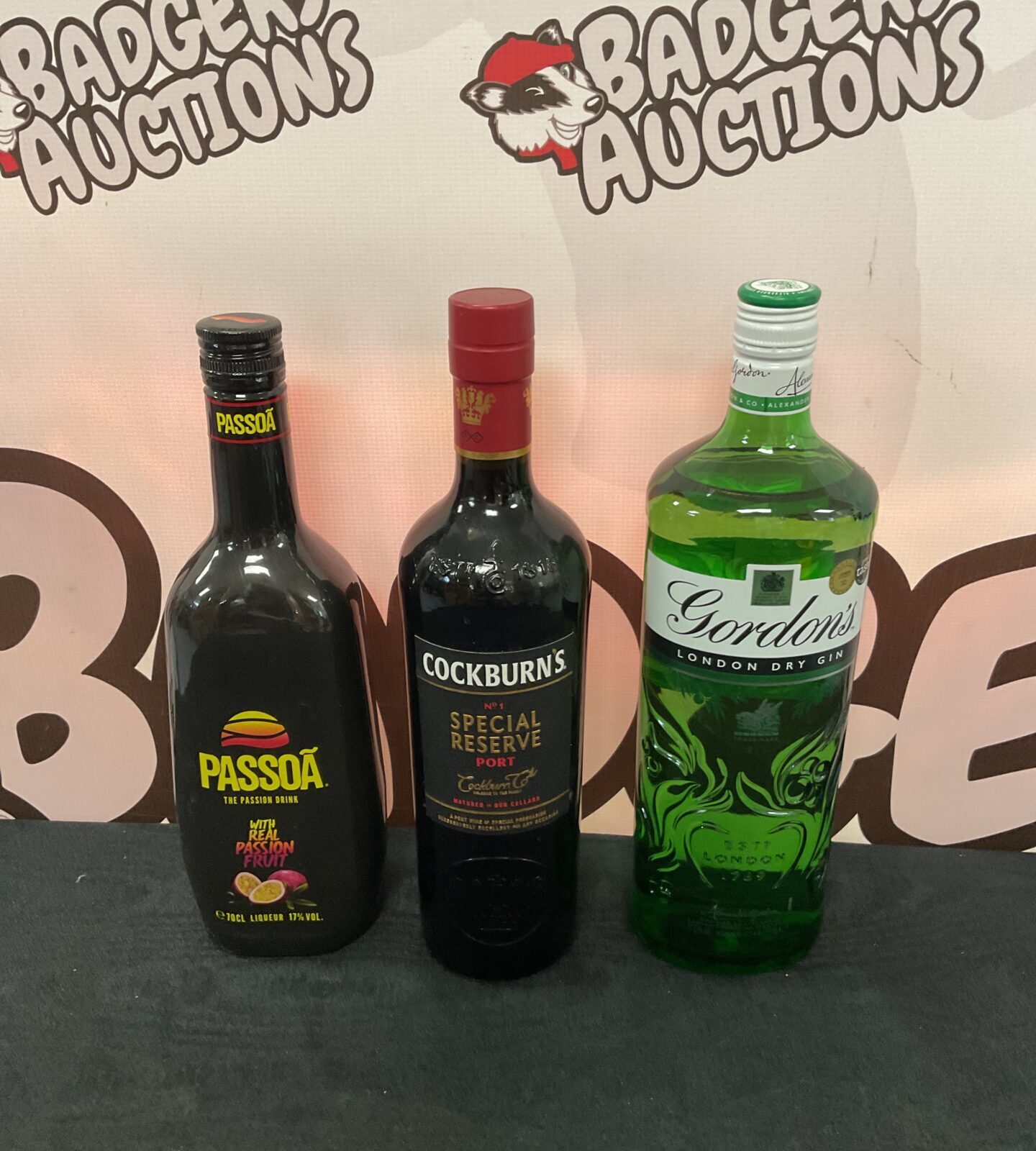 Three sealed bottles of alcohol including gordons dry gin & cockburns special reserve port