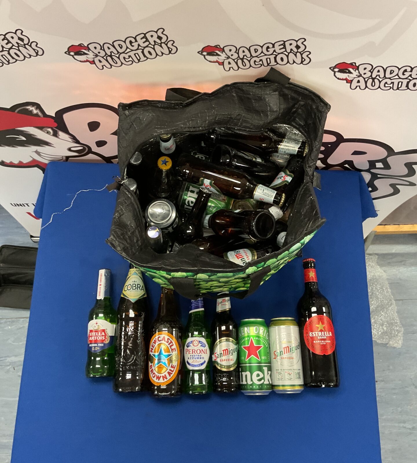 Bag full of mixed beers in date inc san miguel, peroni, estrella, heineken and more