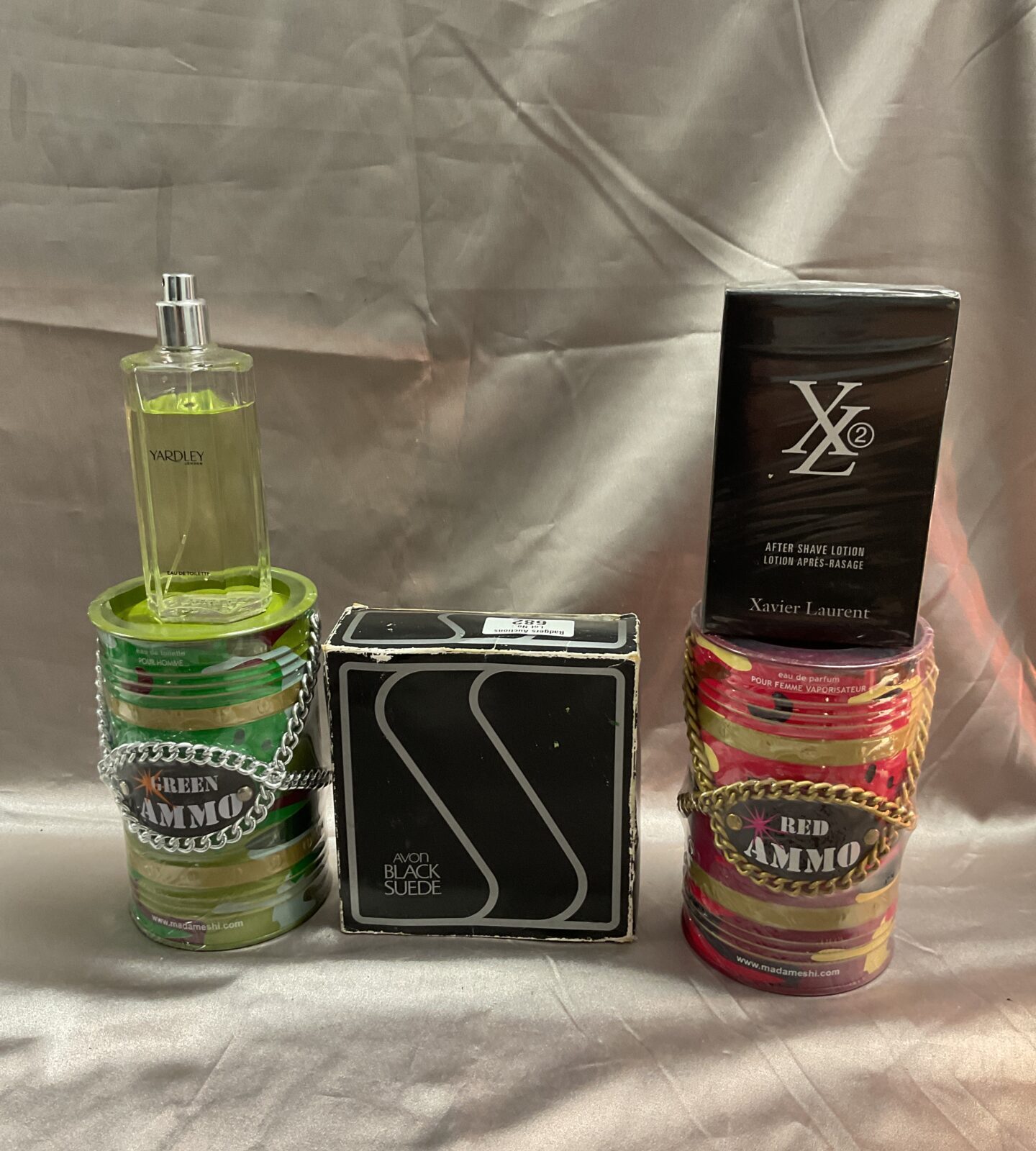 Two tins of green and red ammo eu de toilette Avon black suede xl aftershave and bottle of yardley
