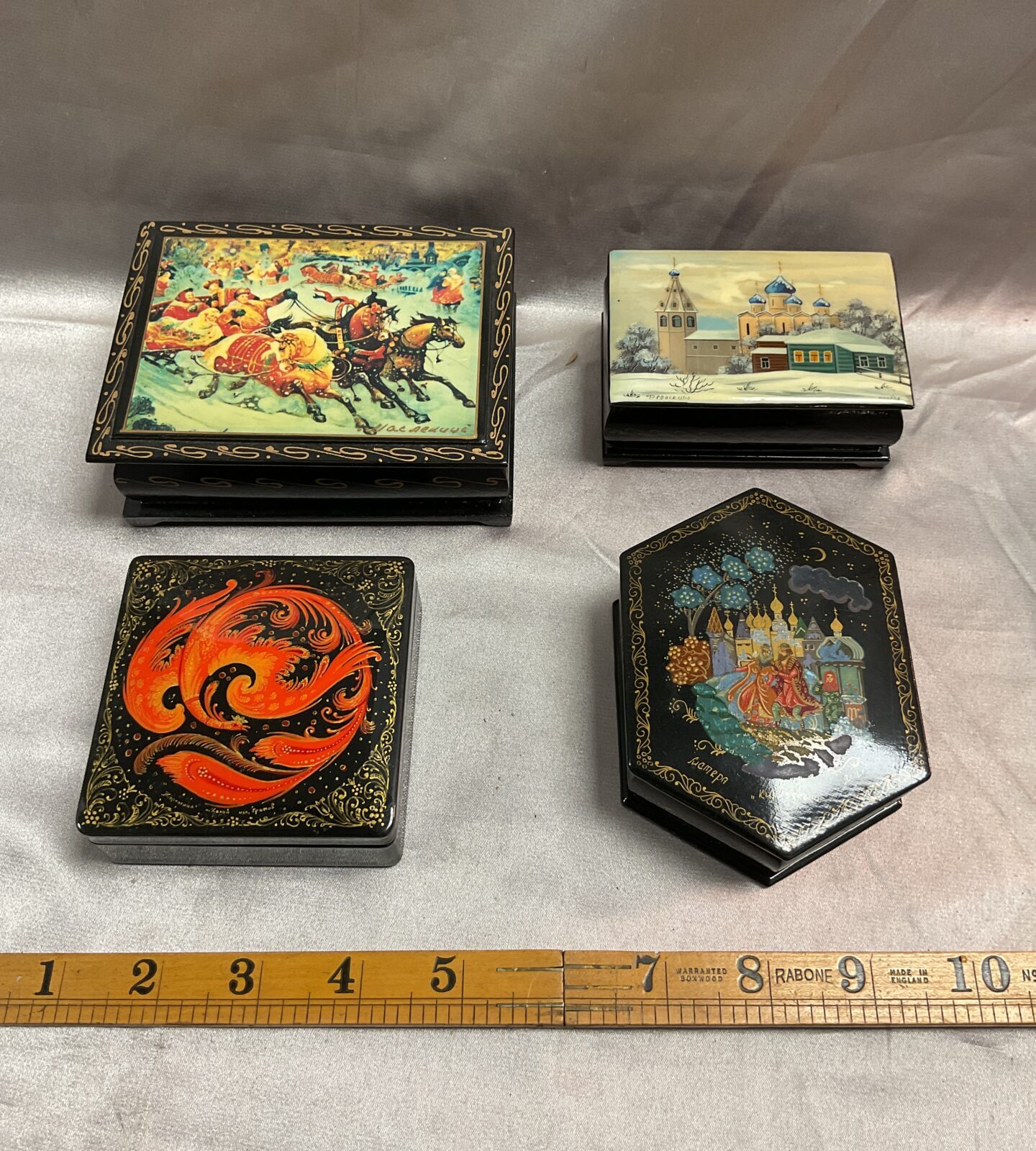 four russian hand painted laquerware boxes