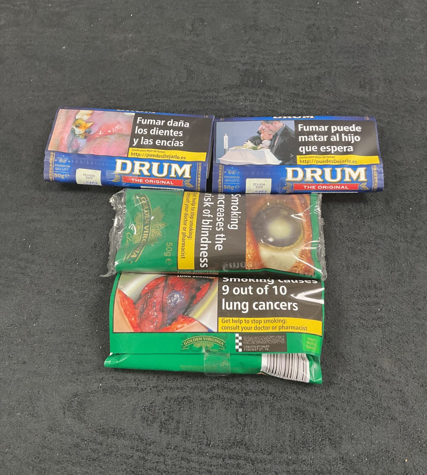 four sealed pouches of 50g Tobacco two drum and two golden virginia