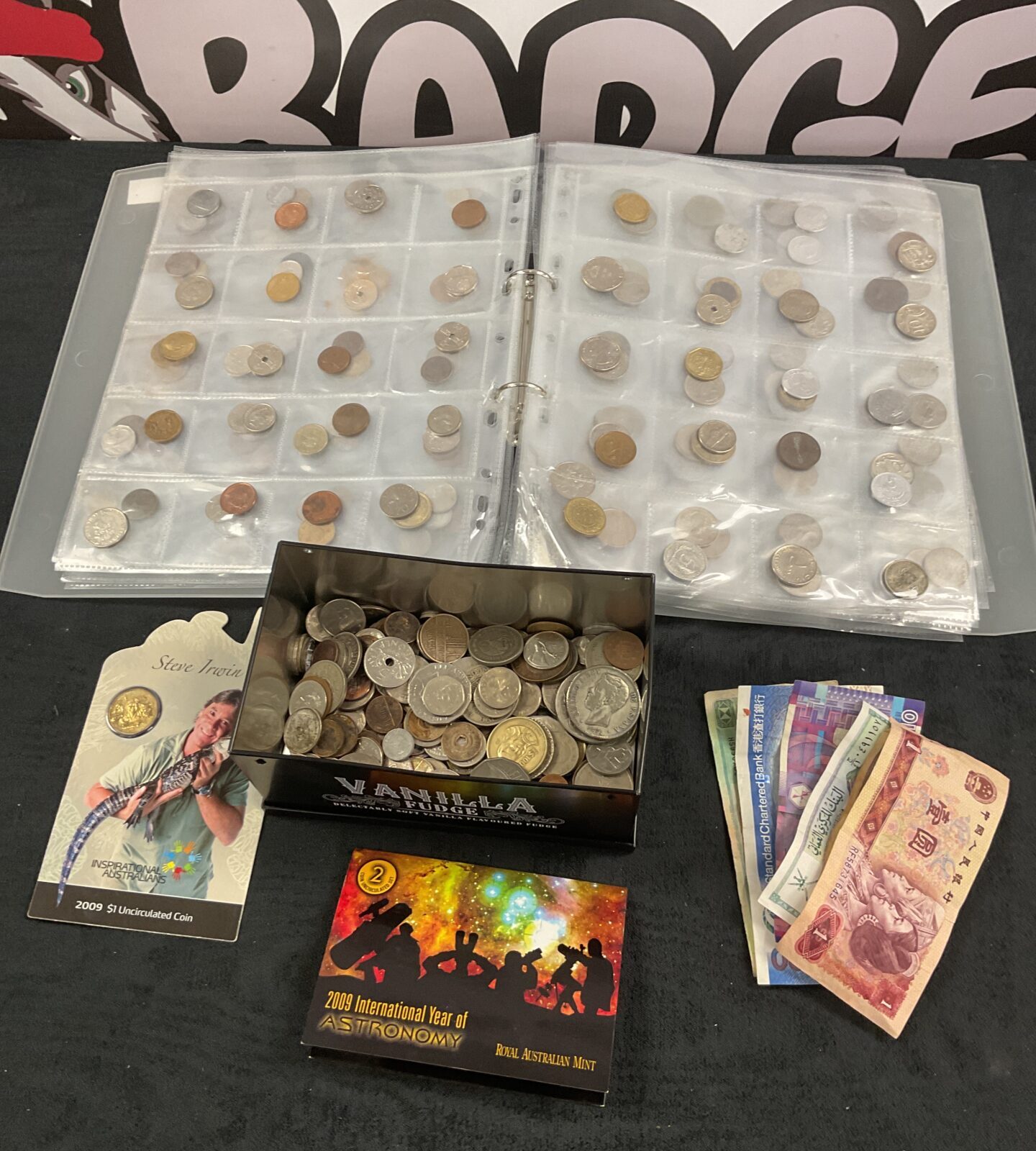 Tin of assorted coins and notes and collection of coins in collectors folder