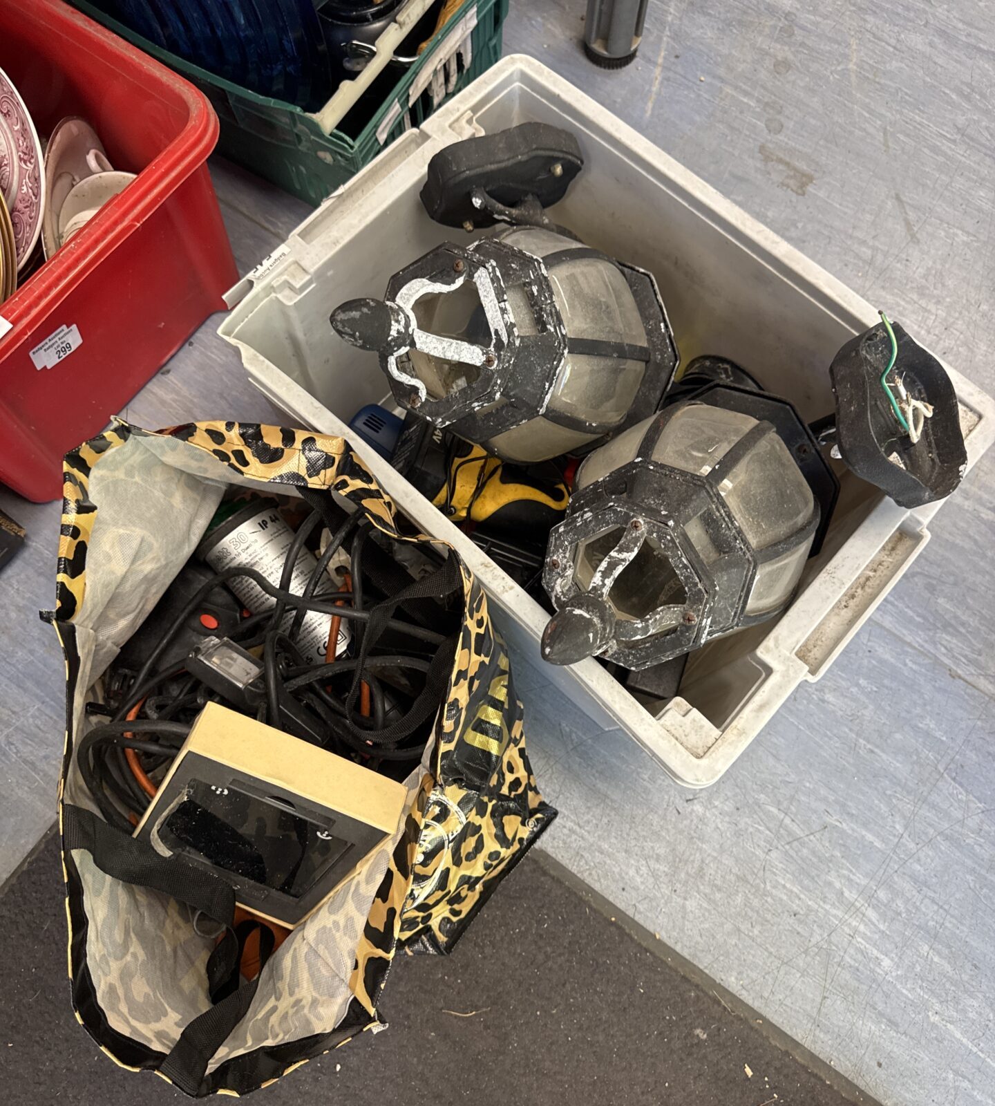 Box of mixed items with a bag of motoring items