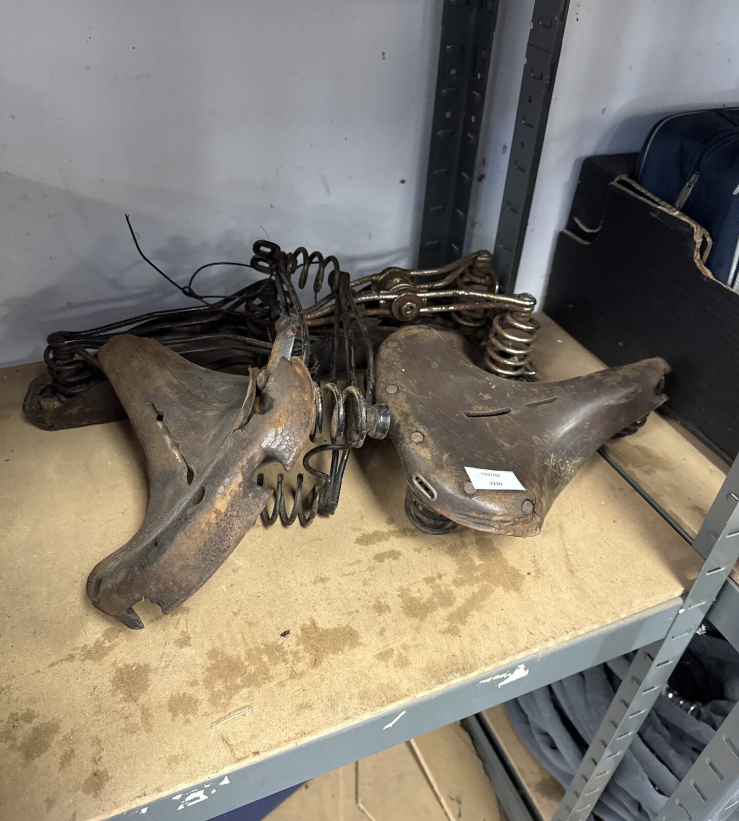 Four vintage bicycle saddles inc Lycetts