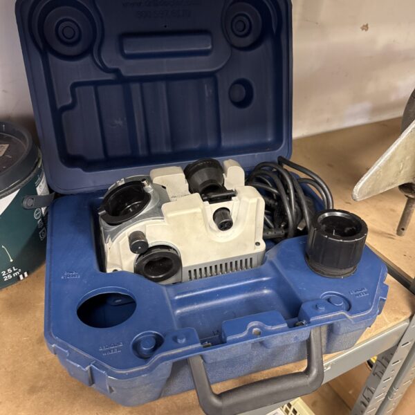 Drill Doctor drill bit sharpener in blue plastic casing.