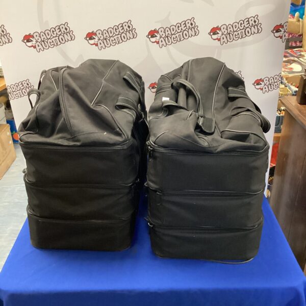 Pair of large dark travel bags for luggage and storage.