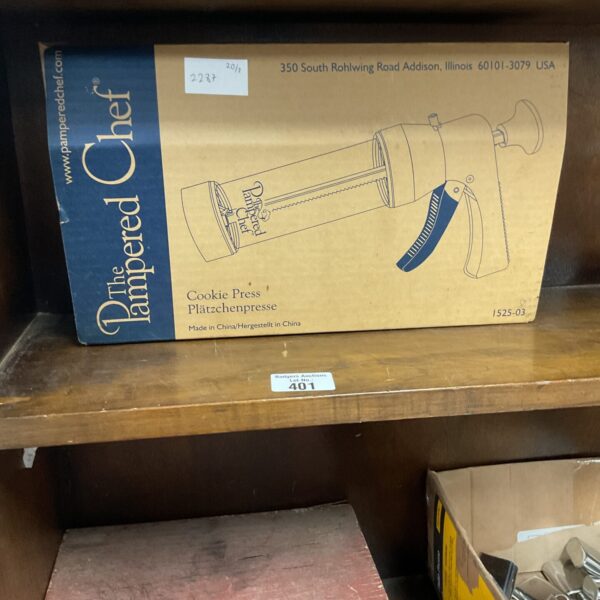 Pampered Chef cookie press, model 350-1899, stainless steel baking tool.