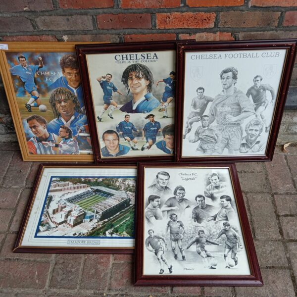 Group of five framed Chelsea Football Club prints for collectors.