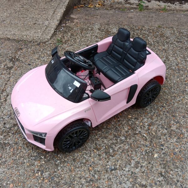 Pink Audi ride-on car for children, electric powered vehicle.