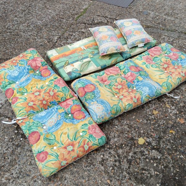 Vibrant floral patterned recliner chair cushions set.