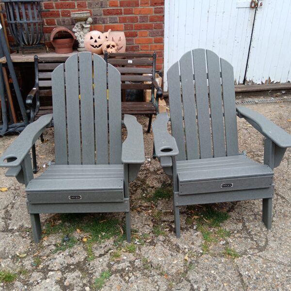 Pair of plastic garden chairs for outdoor seating.