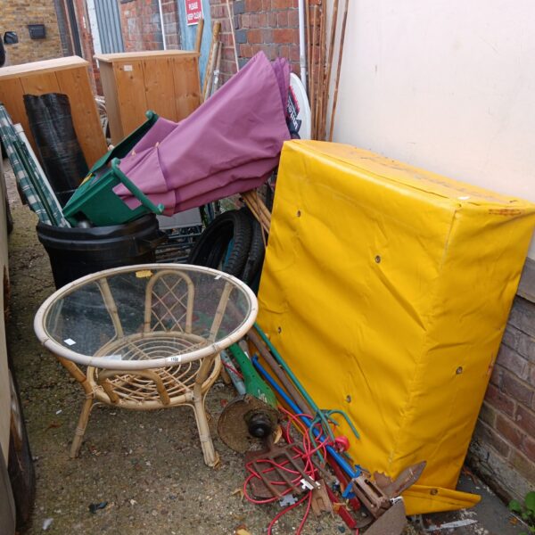 Mixed garden and DIY lot with crash mat and tools.
