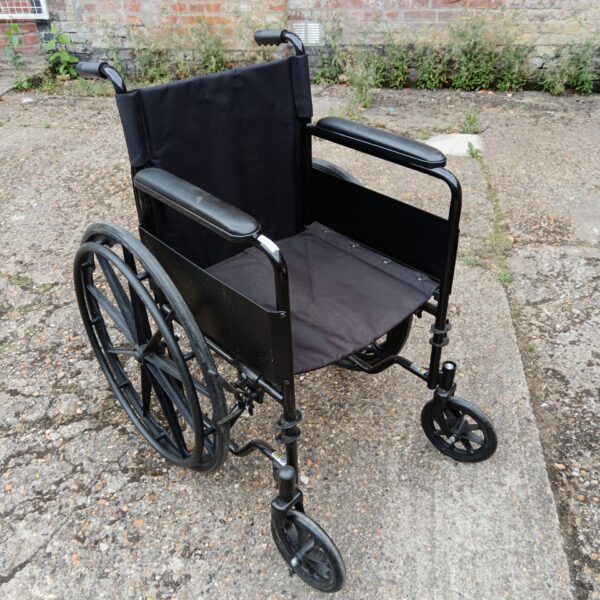 Black folding wheelchair for assisted mobility, side view.