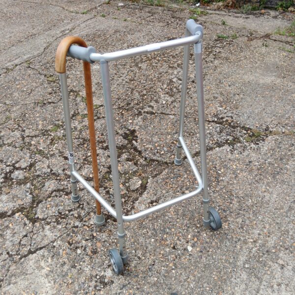 Used NRS Zimmer frame and wooden walking stick for mobility support.