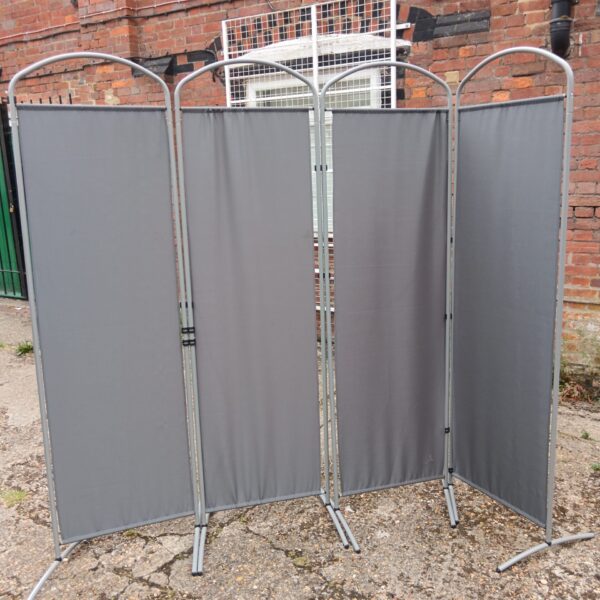 Grey four-panel privacy screen for room division.