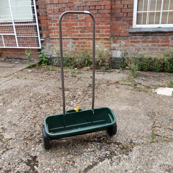 Vintage Evergreen seed spreader for garden use.