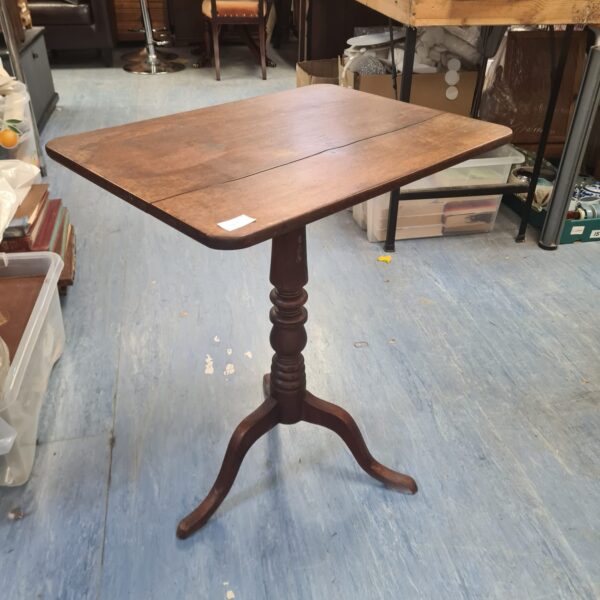 Antique oak tilt top table with tripod base.