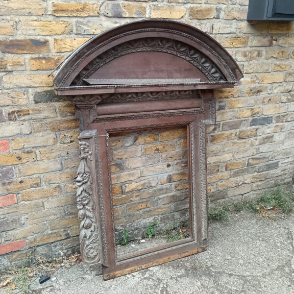 Intricate carving on antique Victorian fire surround.