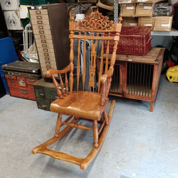 Large heavily carved rocking chair