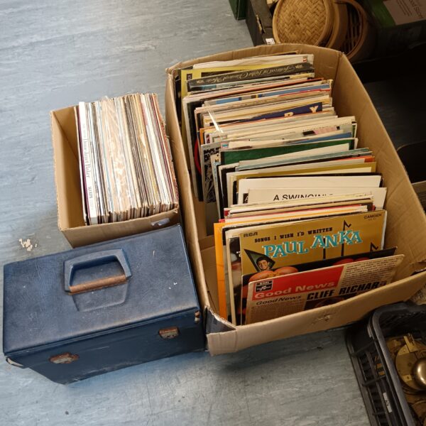 Large lot of vintage jazz vinyl records in a cardboard box.