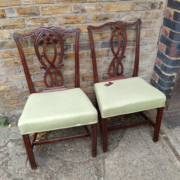 Pair of antique mahogany dining chairs for restoration project.