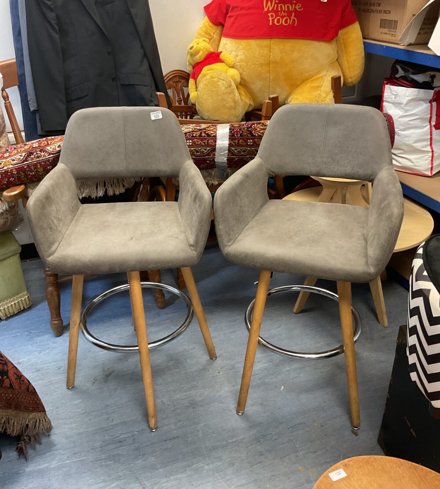 Pair of grey swivel bar stools for kitchen island seating.