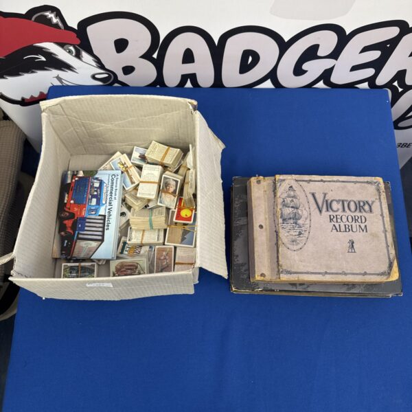 Vintage cigarette cards and Victory record album in a box.