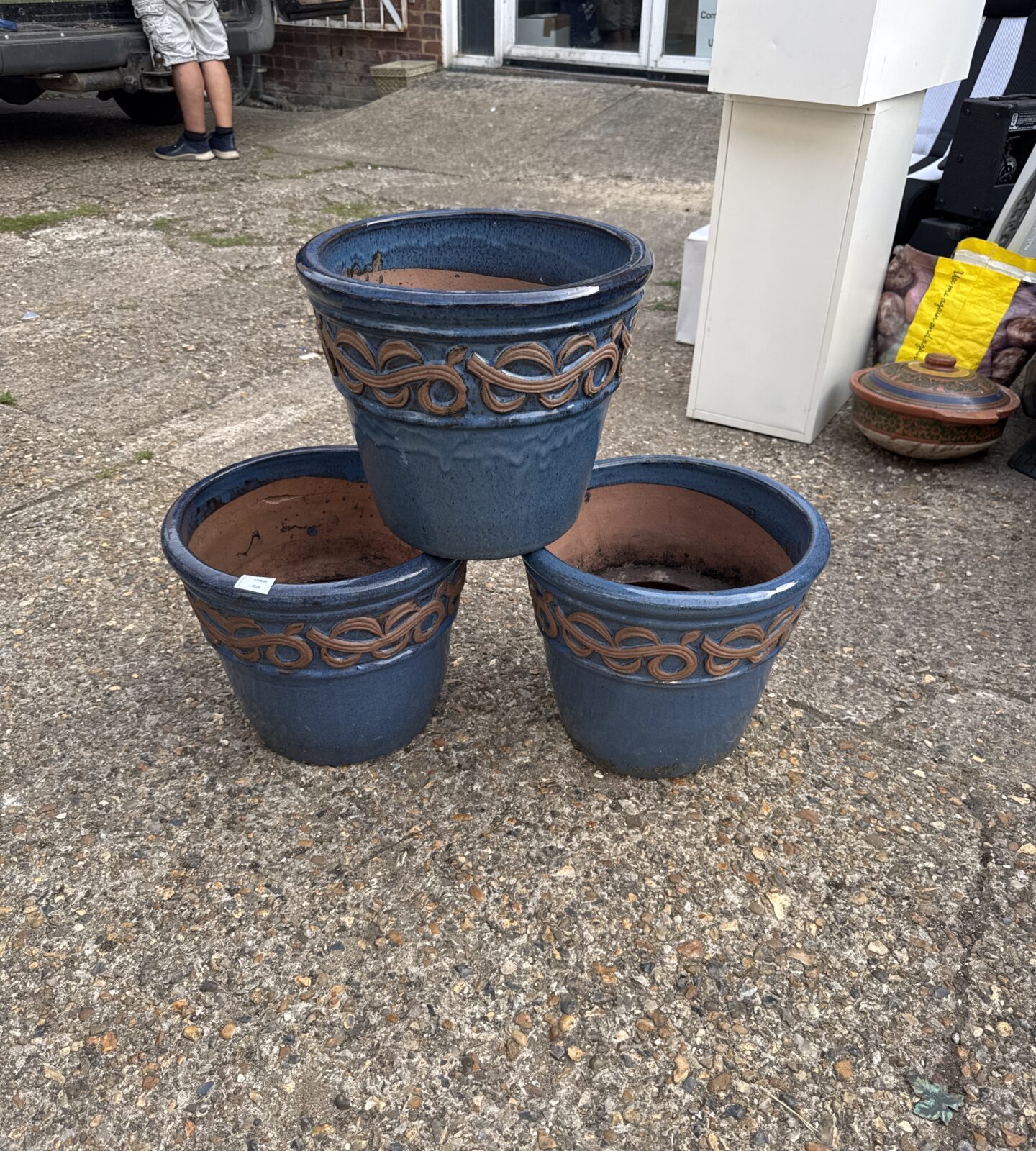 Three large glazed terracotta garden pots