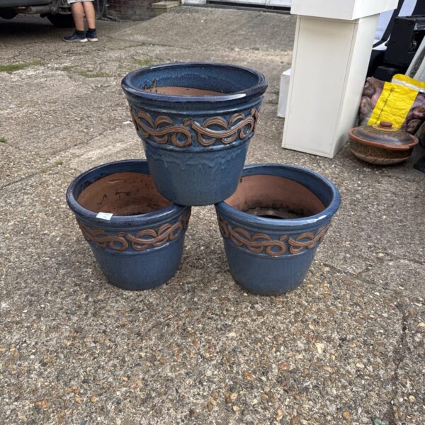 Three large glazed terracotta garden pots