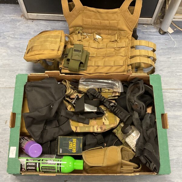 Airsoft tactical vest kit with pouches and accessories.