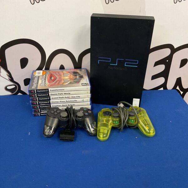Sony PlayStation 2 console with controllers and games for retro gaming.