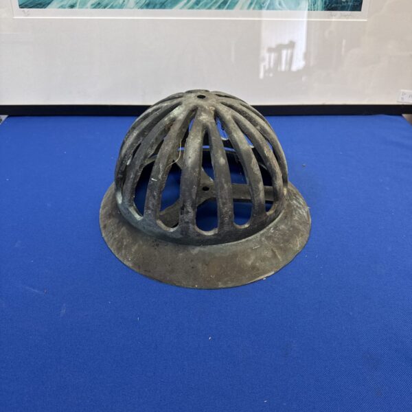Antique cast iron Bank of England ventilation cover with radial bars.