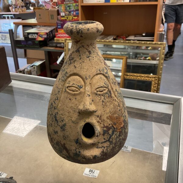 Striking Maya face vase with open mouth design.