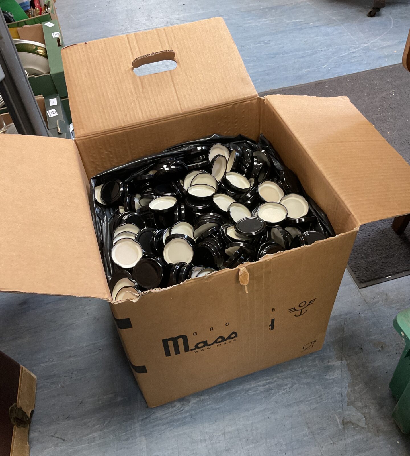 Large box full of jar lids
