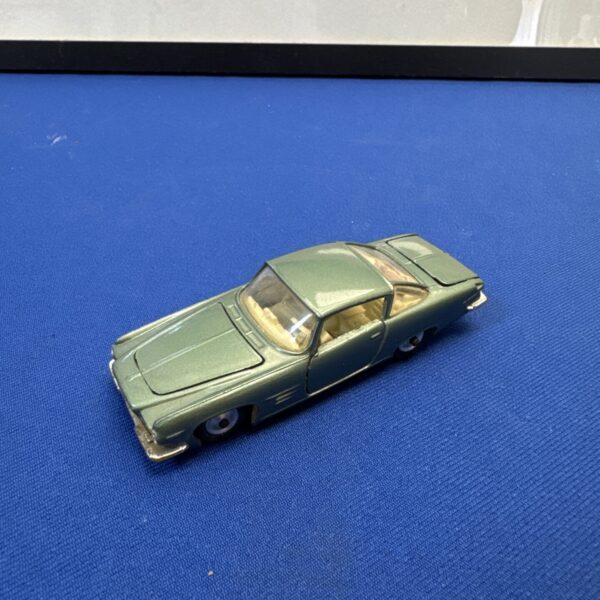 Side view of a vintage Corgi Ford Ghia diecast car.